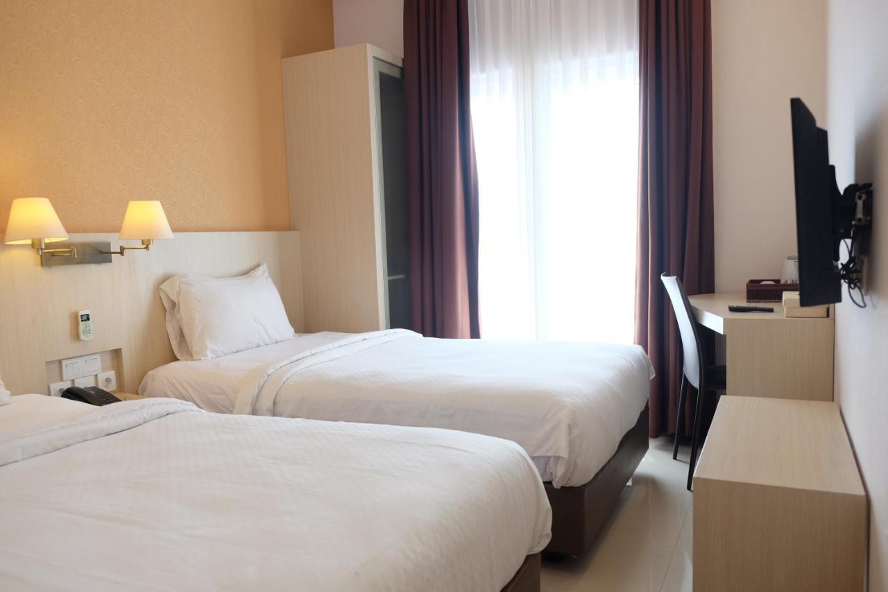 Rio City Hotel Palembang Esterno foto