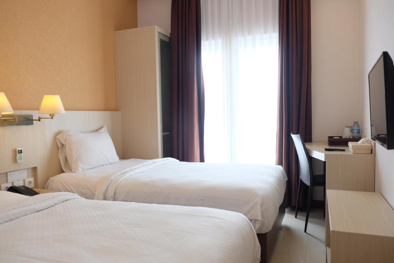 Rio City Hotel Palembang Esterno foto