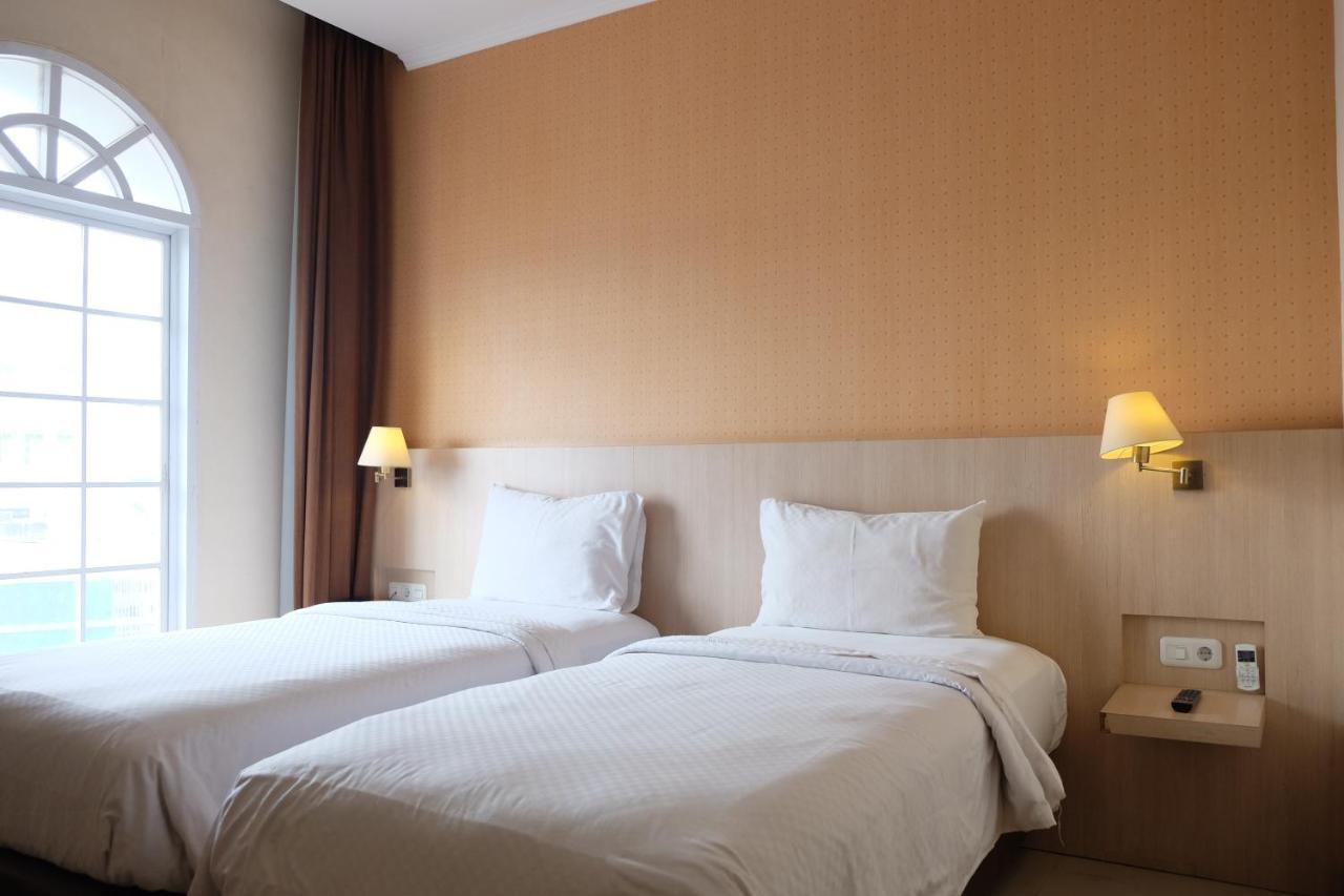 Rio City Hotel Palembang Esterno foto